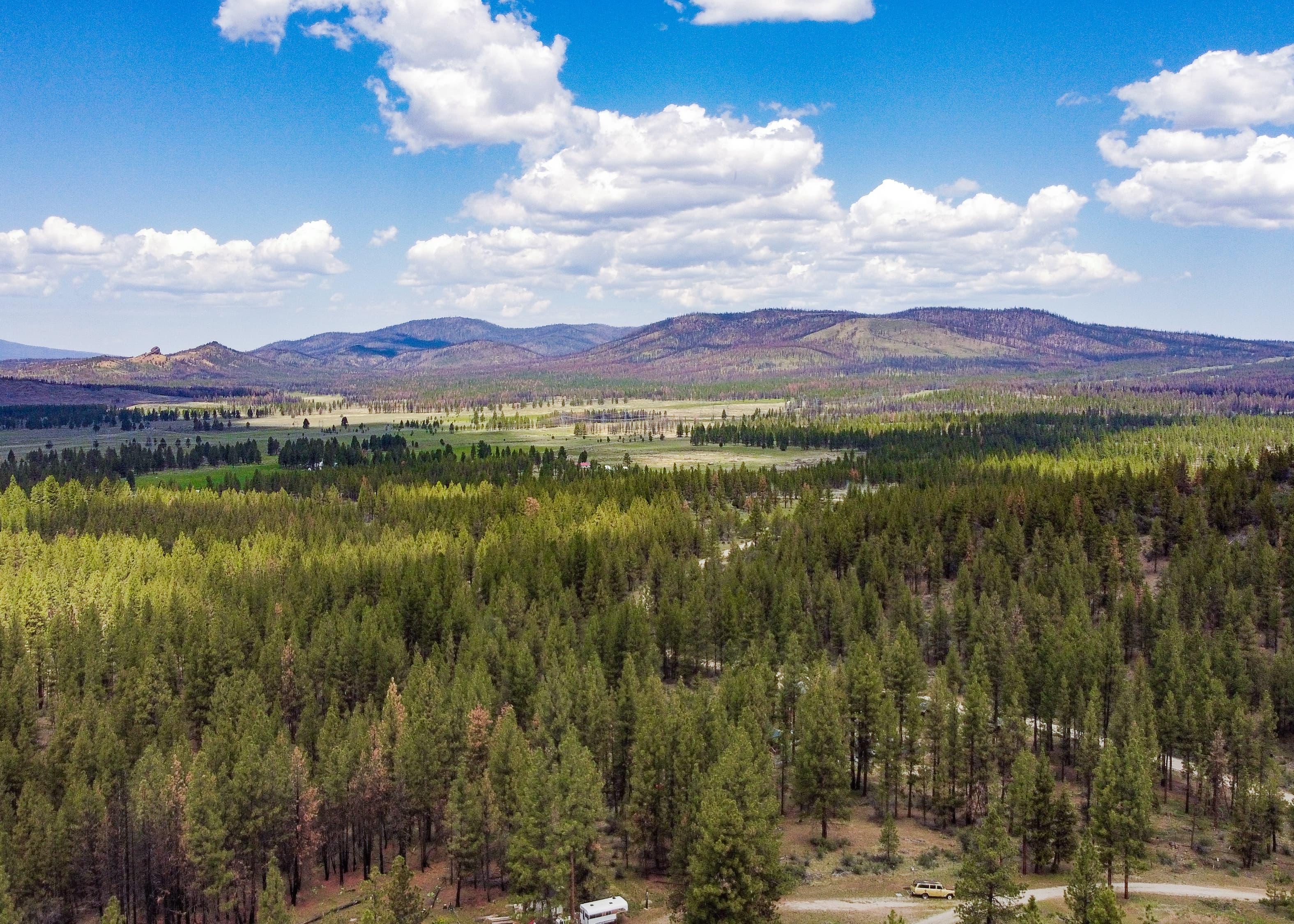 Aerial photo from the northwest showing forested terrain and sagebrush understory in Klamath County, Oregon.