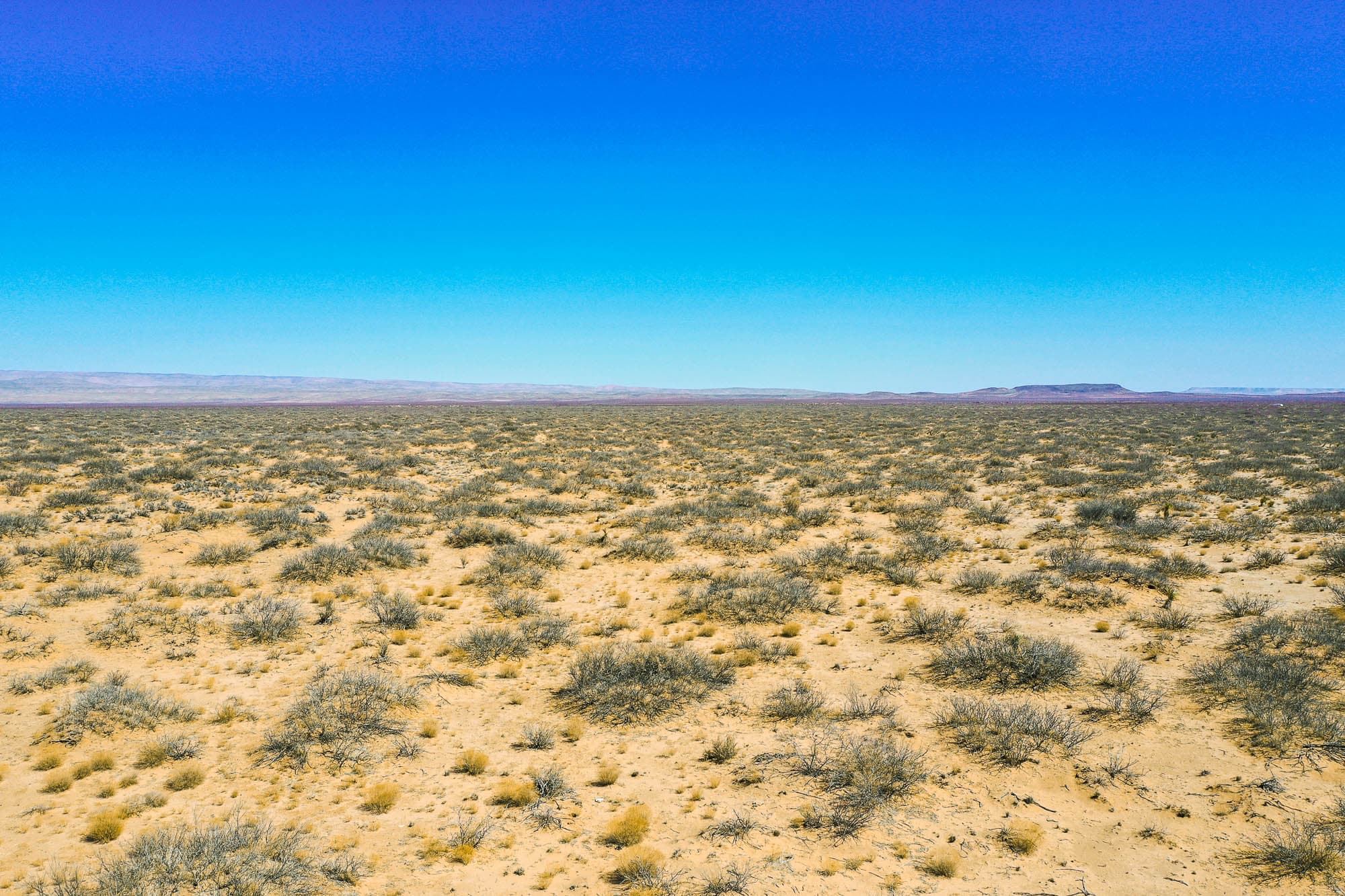 Drone photo of the parcel with distant mountain range visible on the horizon in Culberson County, Texas.